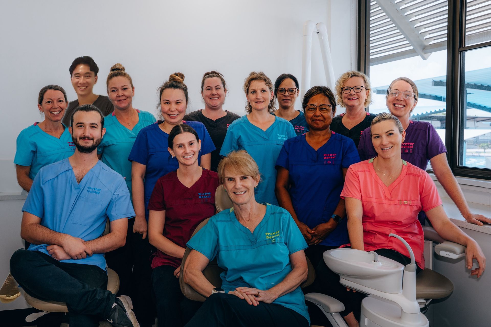A Group of People in Scrubs are Posing for a Picture — Trower Dental In Casuarina, NT