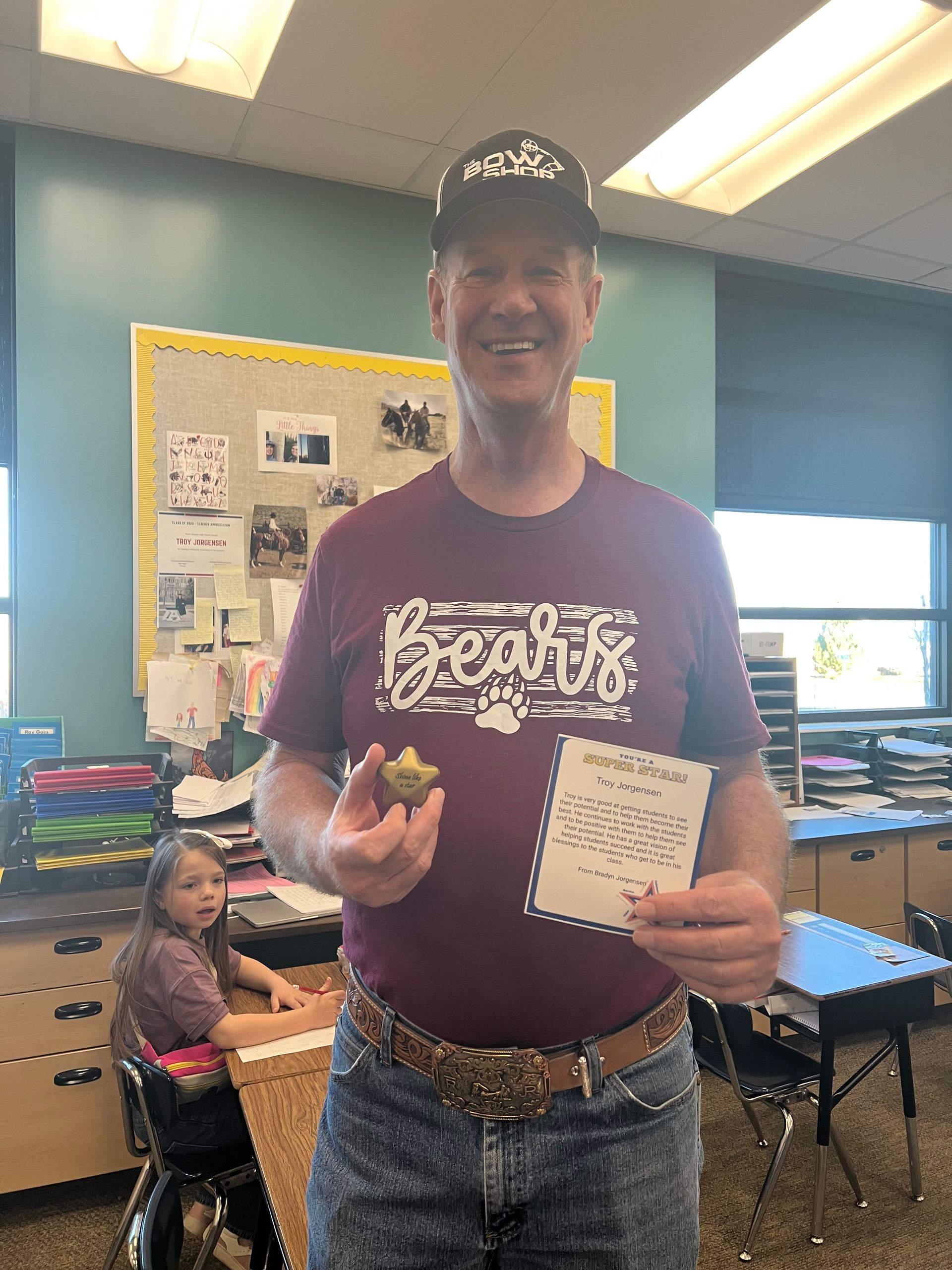 A teacher in a maroon 