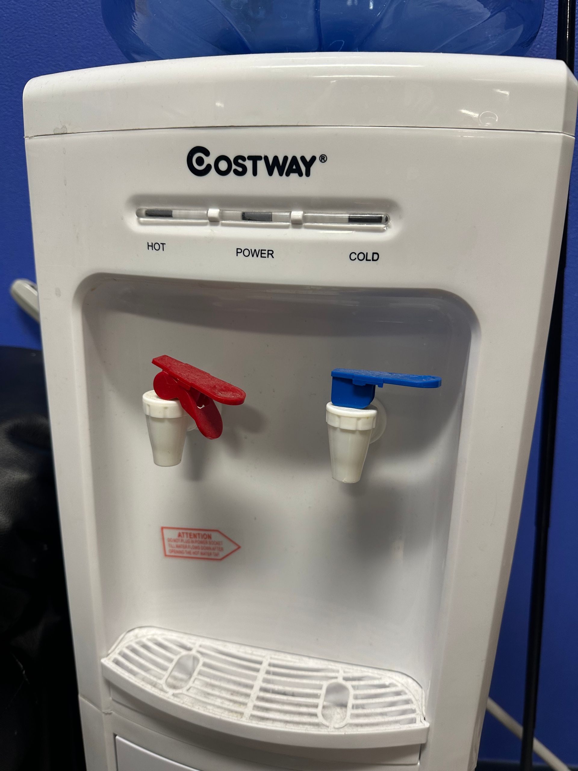 A white costway water dispenser with red and blue faucets