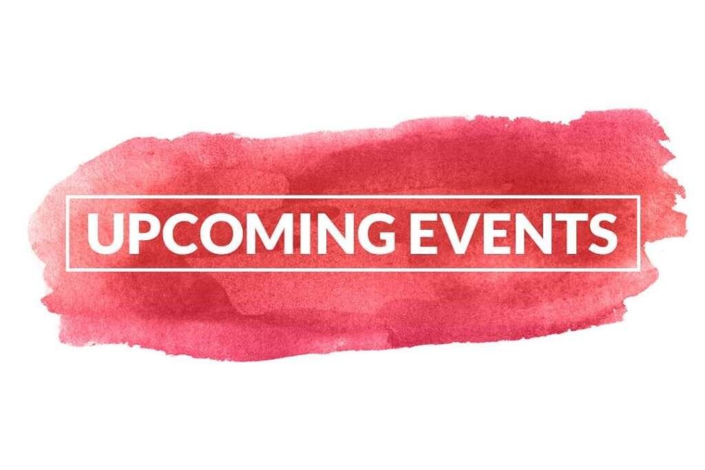 A man in white gloves is holding an american flag in front of a woman.