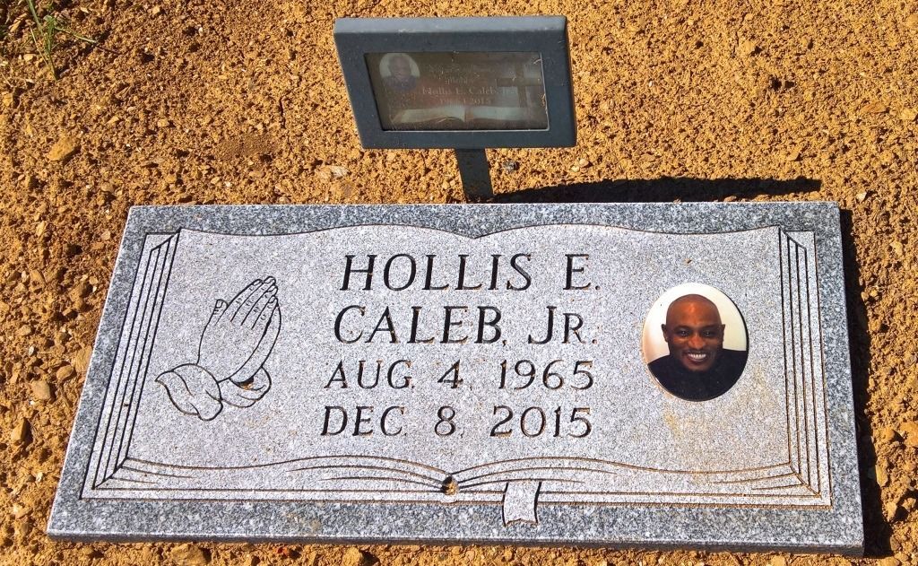 Headstone for Hollis E. Caleb, Jr., including his photo, dates of birth and death, and praying hands.