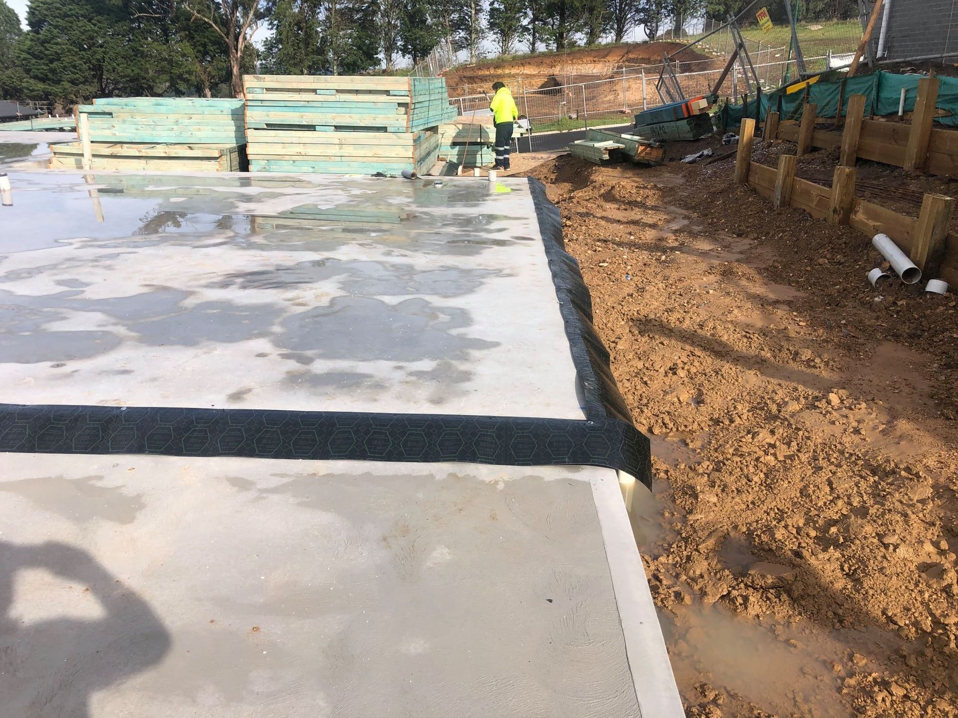 A Construction Site With a Concrete Floor and a Lot of Dirt — TC Pest & Termite Control In Bowral, NSW