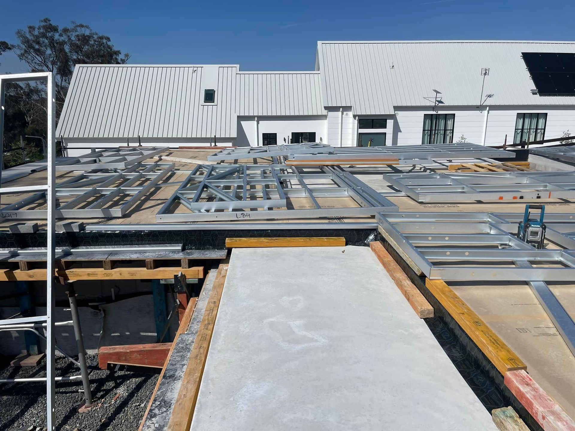 A Construction Site With a Large White Building in the Background — TC Pest & Termite Control In Bowral, NSW