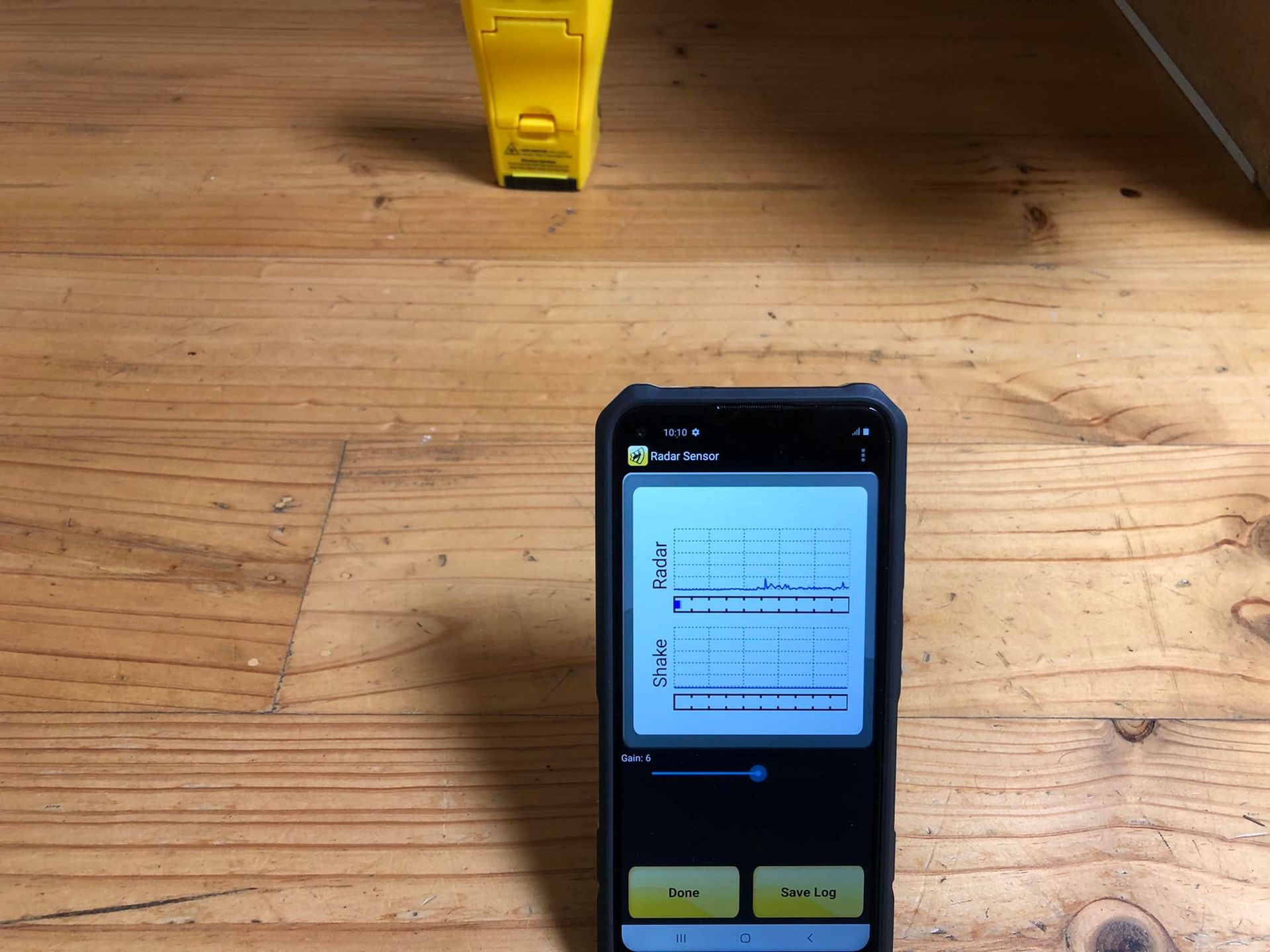 A Pest Control Device With a Graph on the Screen is on a Wooden Platform — TC Pest & Termite Control In Bowral, NSW