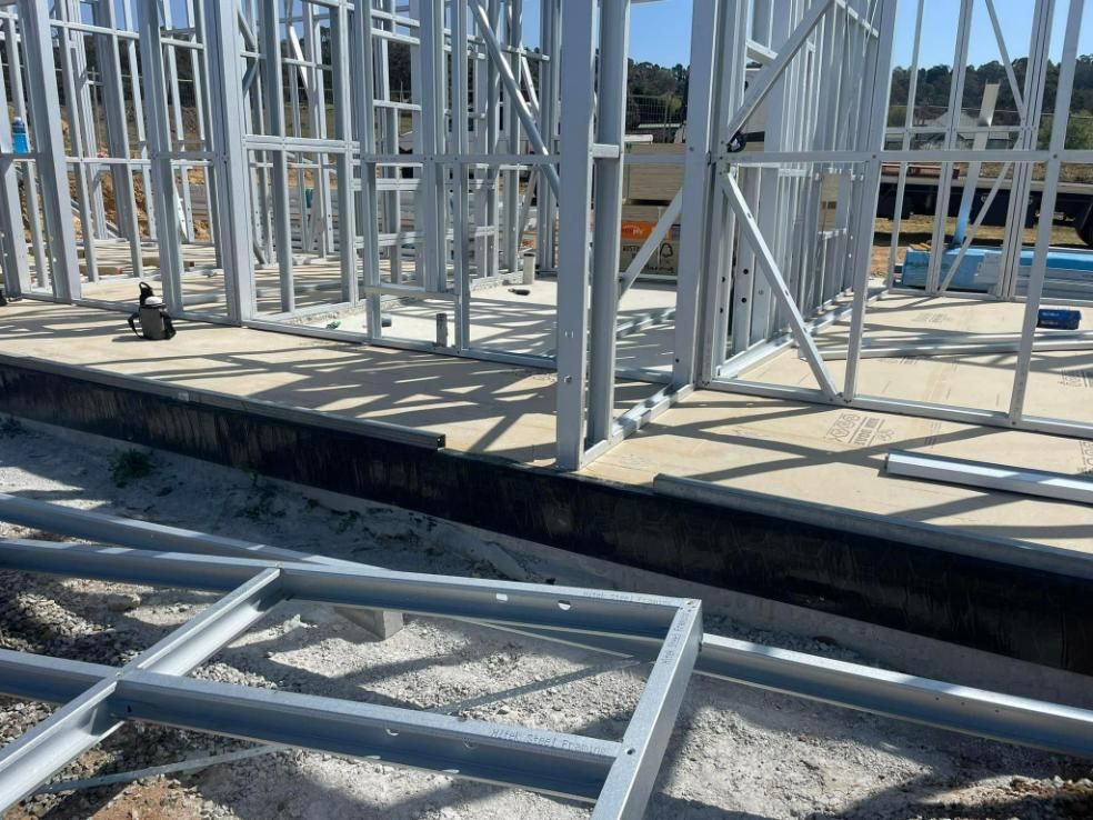 A Building Under Construction With a Lot of Metal Frames on the Ground — TC Pest & Termite Control In Bowral, NSW