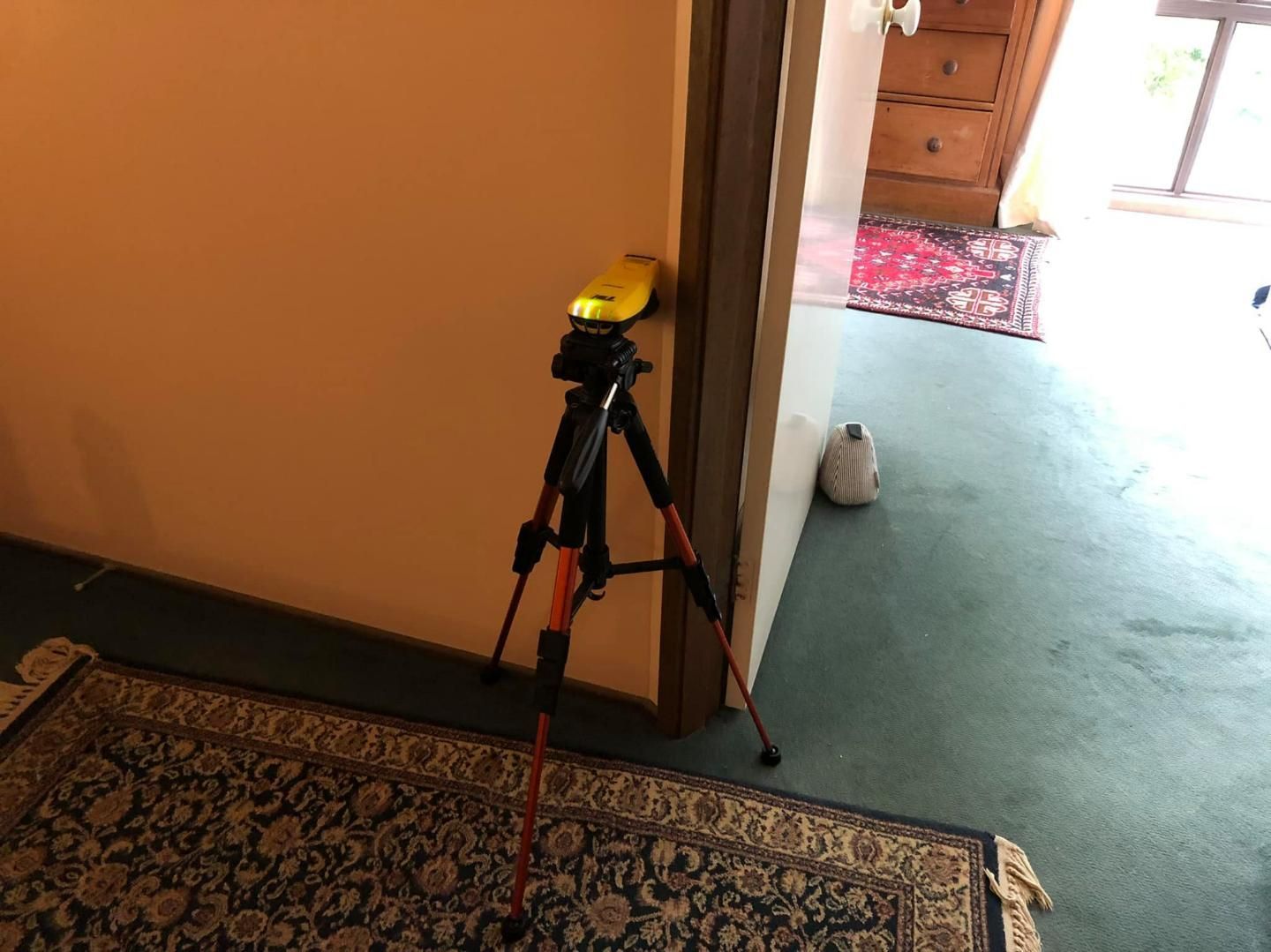 A Pest Control Device is Sitting in a Hallway Next to a Door — TC Pest & Termite Control In Bowral, NSW