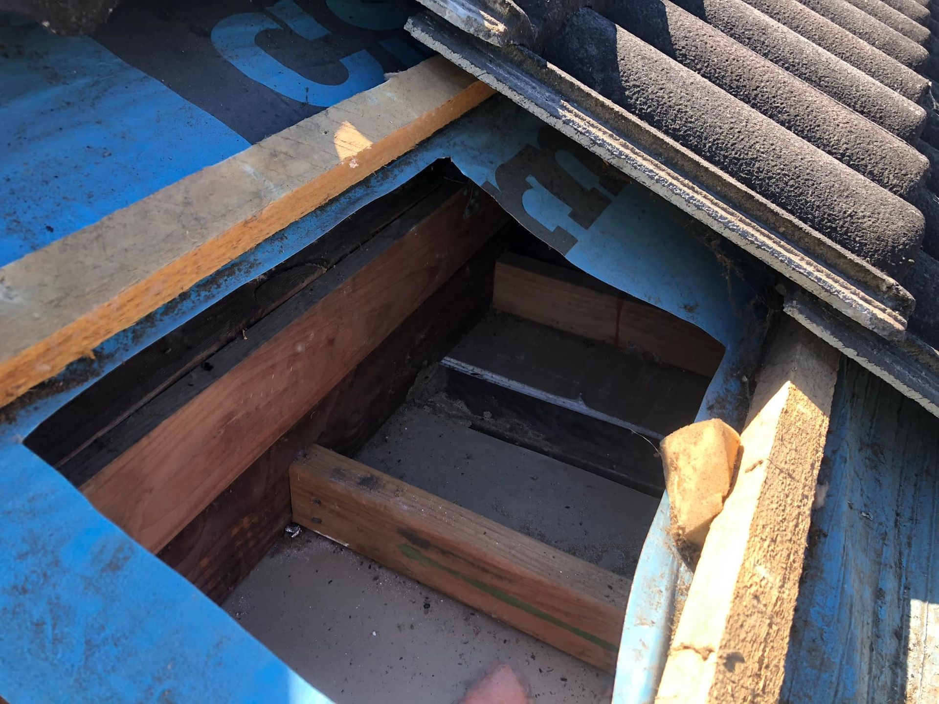 A Roof With a Hole in It and a Few Pieces of Wood — TC Pest & Termite Control In Bowral, NSW