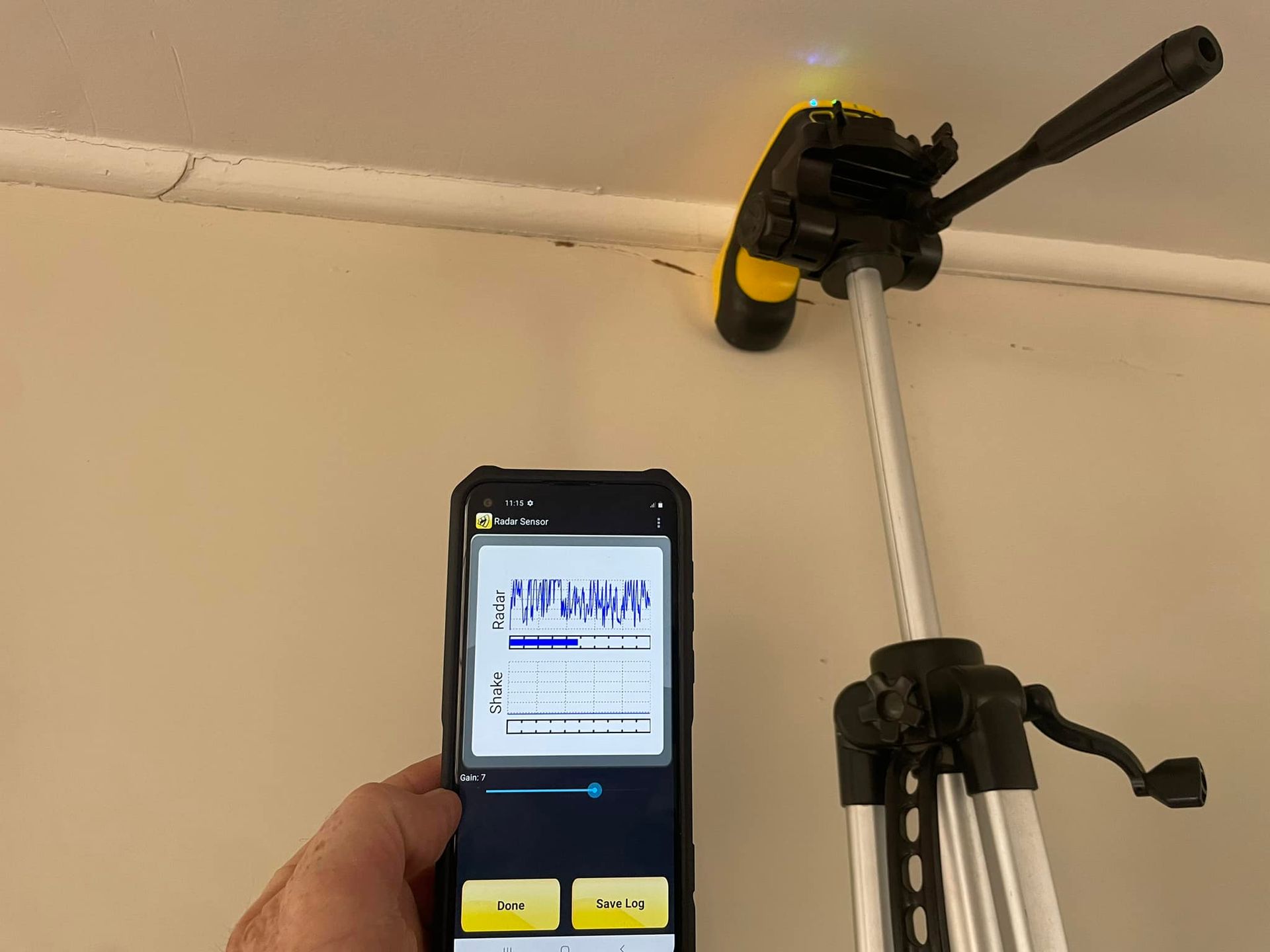 A Person is Holding a Pest Control Device — TC Pest & Termite Control In Moss Vale, NSW