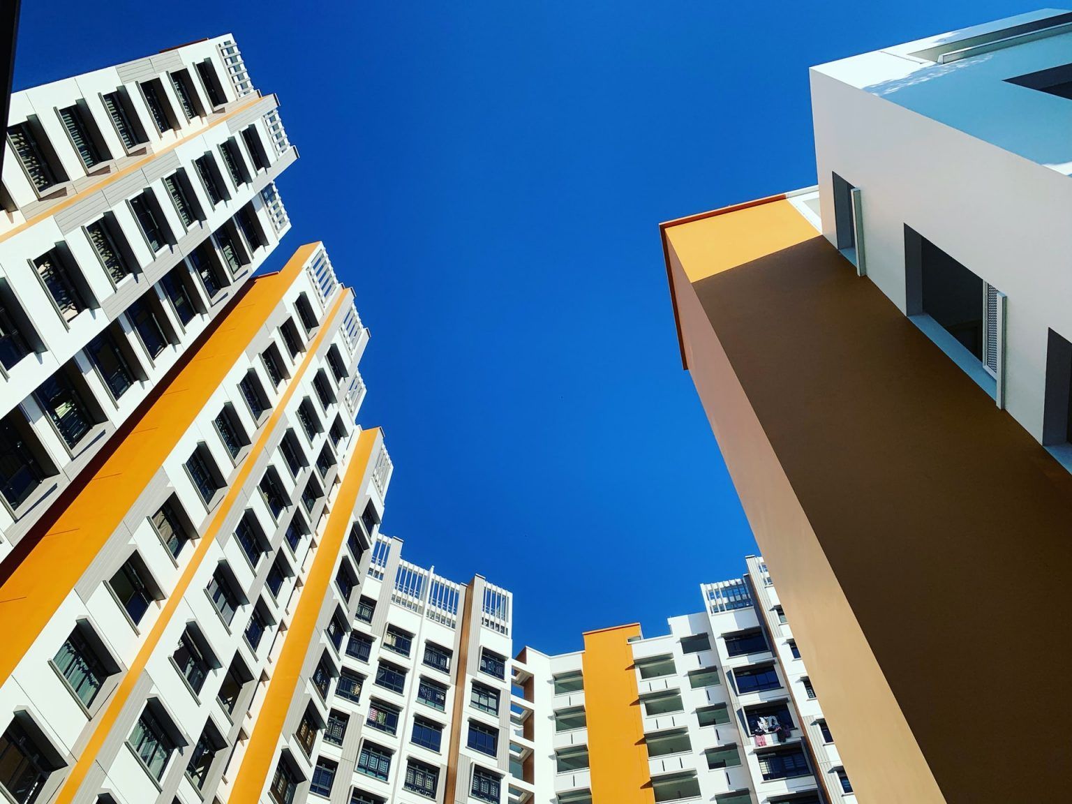 Looking up at a building with a blue sky in the background