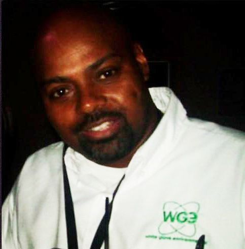 A man wearing a white shirt with the word wg3 on it