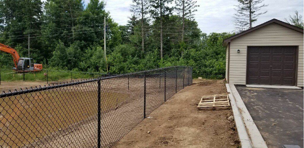 Outdoor Fencing — Small House with Fence in Deerwood, MN