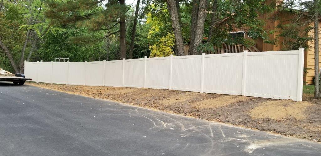 Fence Installation — Long White Vinyl Fence in Deerwood, MN