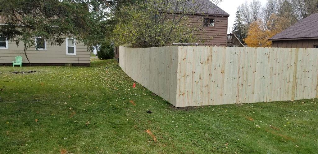Wooden Fencing — House Backyard with Wooden Fence in Deerwood, MN