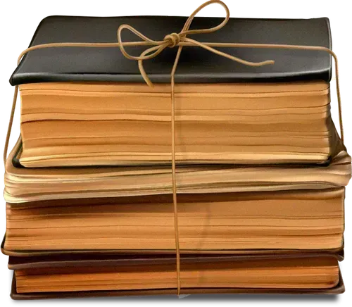 A stack of three books with aged, yellowed pages, bound together with a thin string tied in a bow on top.