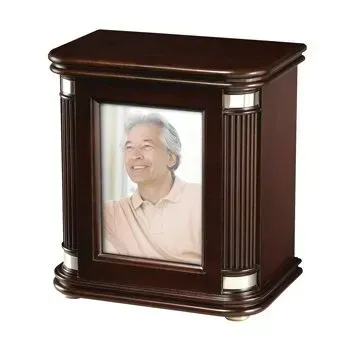 Wooden memorial urn with a framed portrait on the front and dark polished finish