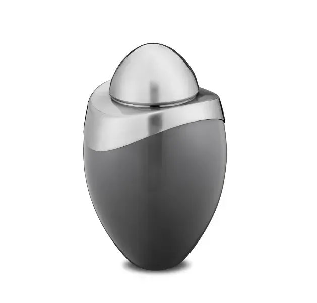 Silver and dark gray oval tabletop air freshener with a domed top on a white background