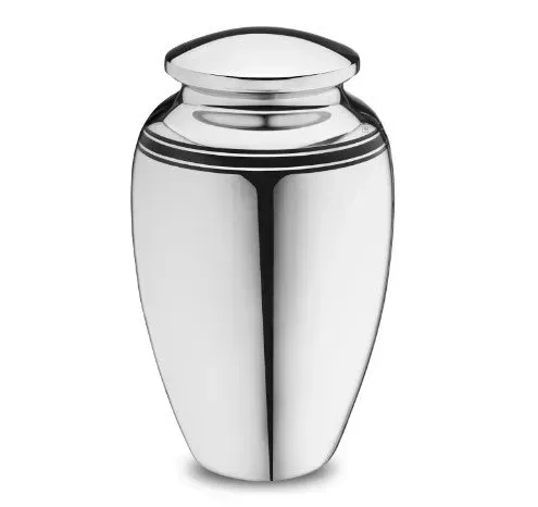 Shiny silver funeral urn with a rounded lid on a white background