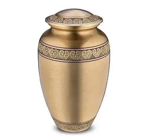 Gold decorative urn with ornate patterned bands and a domed lid