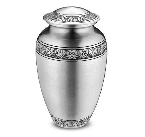 Decorative silver urn with ornate patterned bands and a domed lid