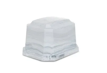 Stack of folded white cloths on a flat surface