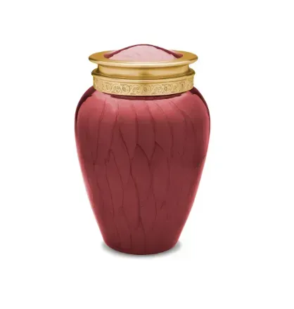 Red decorative vase with a gold rim and lid on a white background