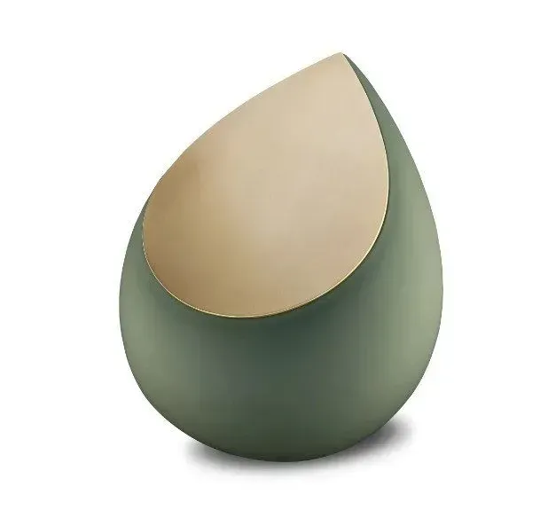 Green teardrop-shaped egg with a beige top on a white background