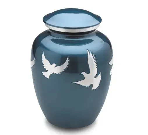 Blue decorative vase with white bird silhouettes and a silver rim