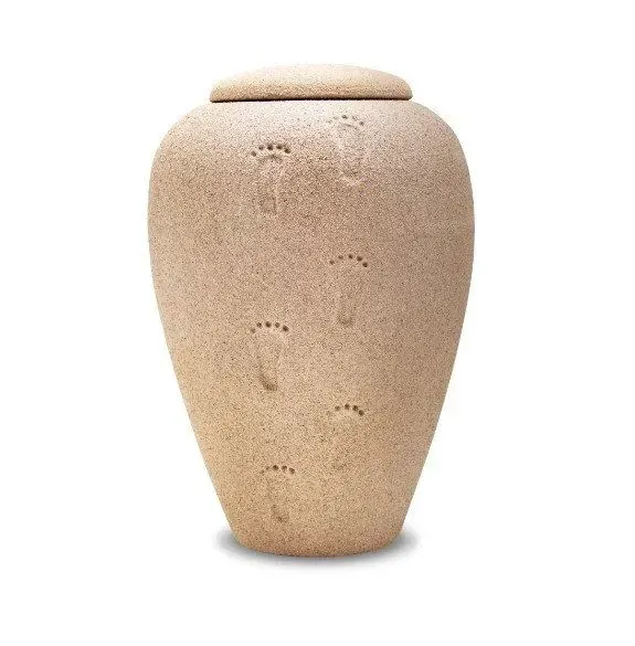 Beige stone urn with a rounded lid on a white background