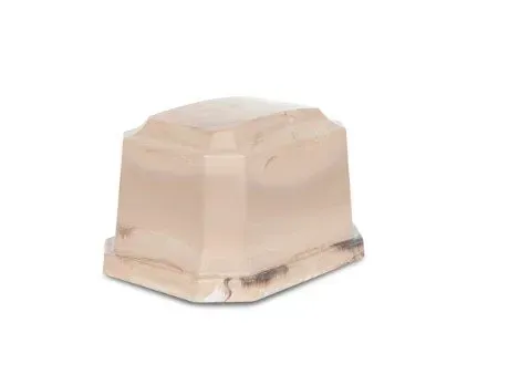 Beige plastic stool with a curved top and dark scuff marks on a white background