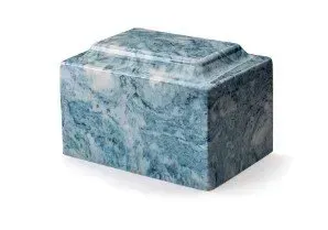 Blue-gray marbled decorative box with a carved lid on a white background