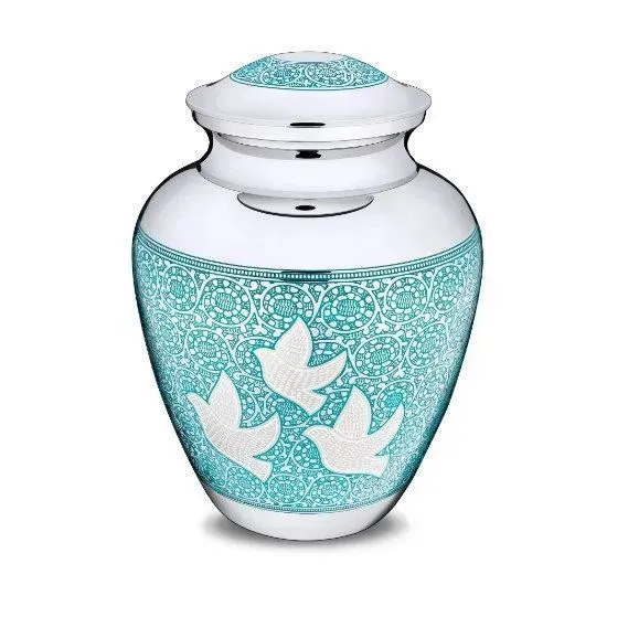 Turquoise and silver memorial urn with white doves on a white background