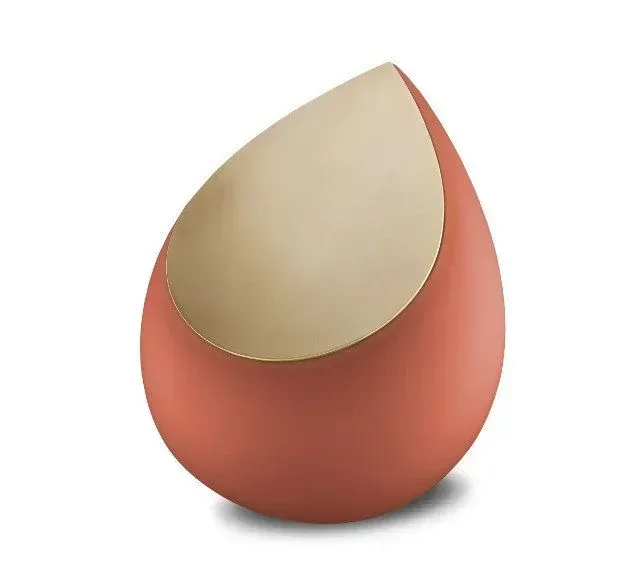 Orange teardrop-shaped object with a beige top on a white background