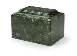 Dark green marble cremation urn with a sloped lid on a white background