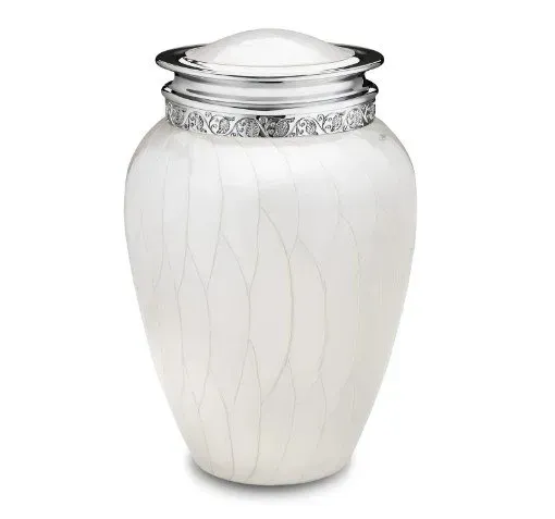 White decorative urn with silver rim and embossed floral pattern on a plain background