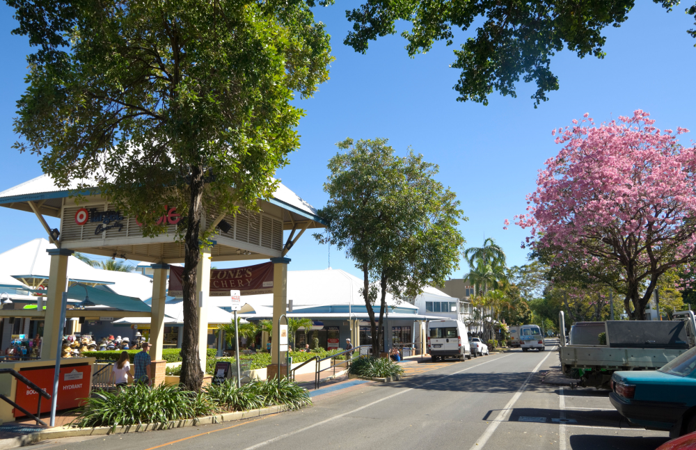 A street scene with a sign that says ' sydney ' on it