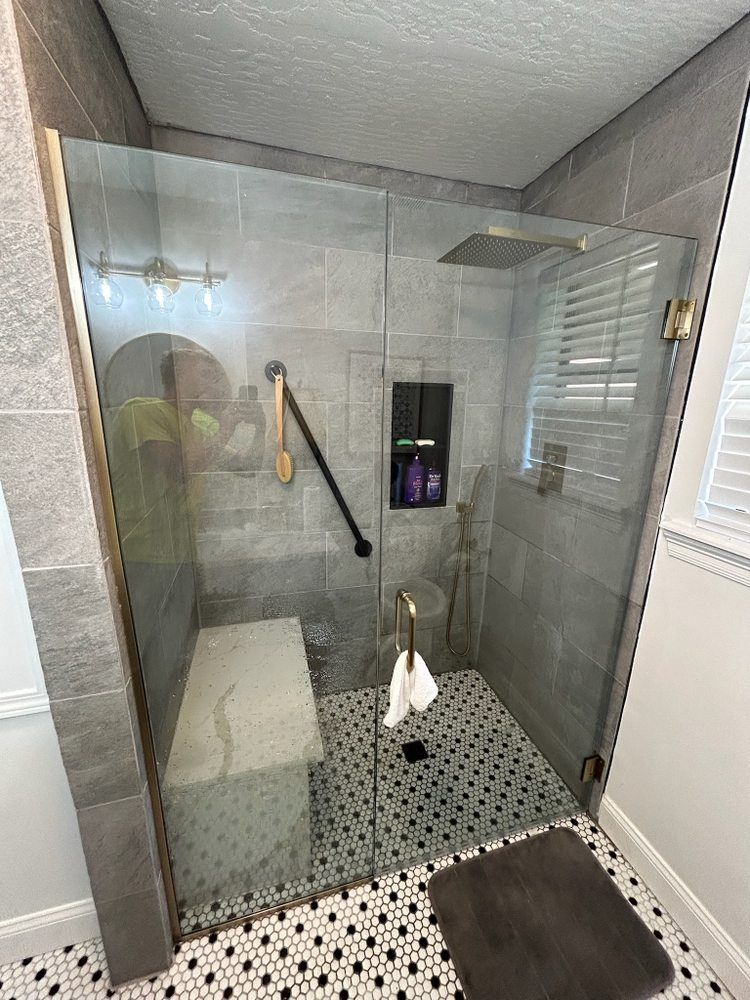 A large house with a garage and a driveway in front of it.