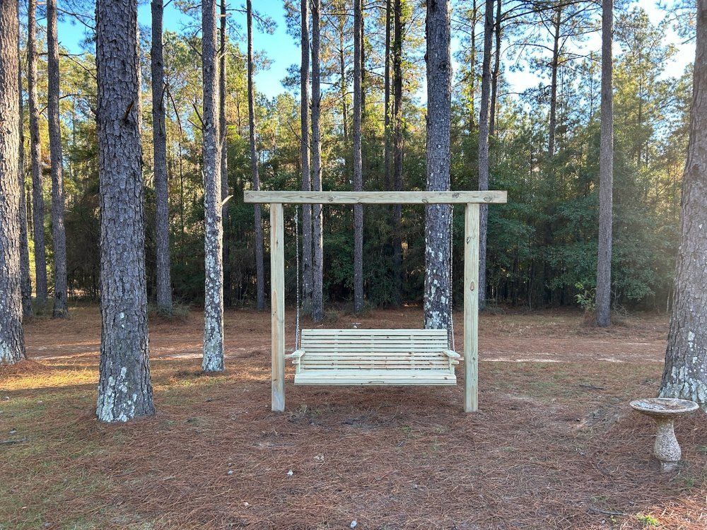A large house with a lot of windows and a garage on a rainy day.