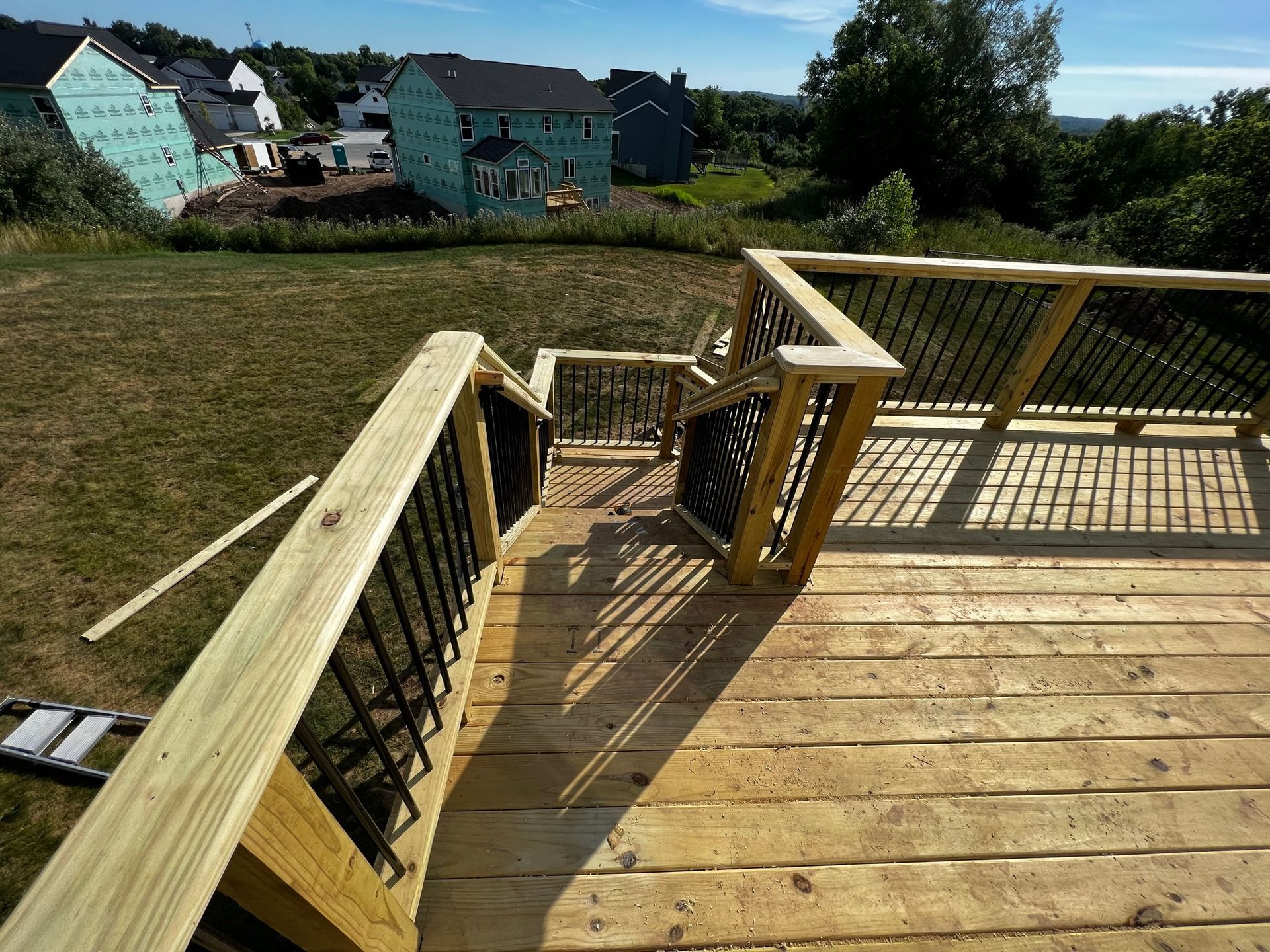 a wooden deck with stairs leading up to it