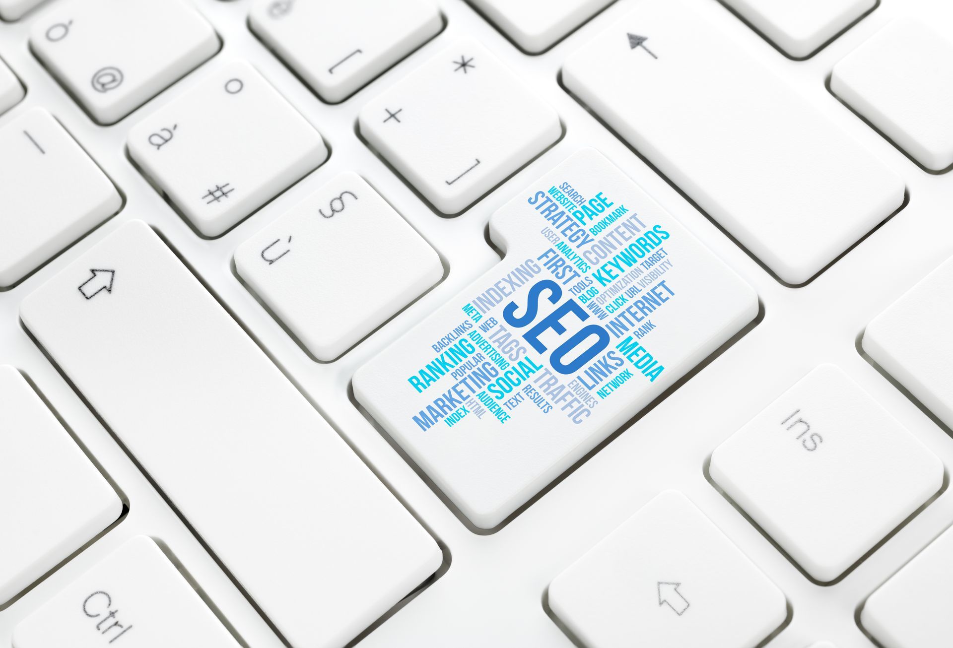 White keyboard with a cloud-shaped graphic of the word 