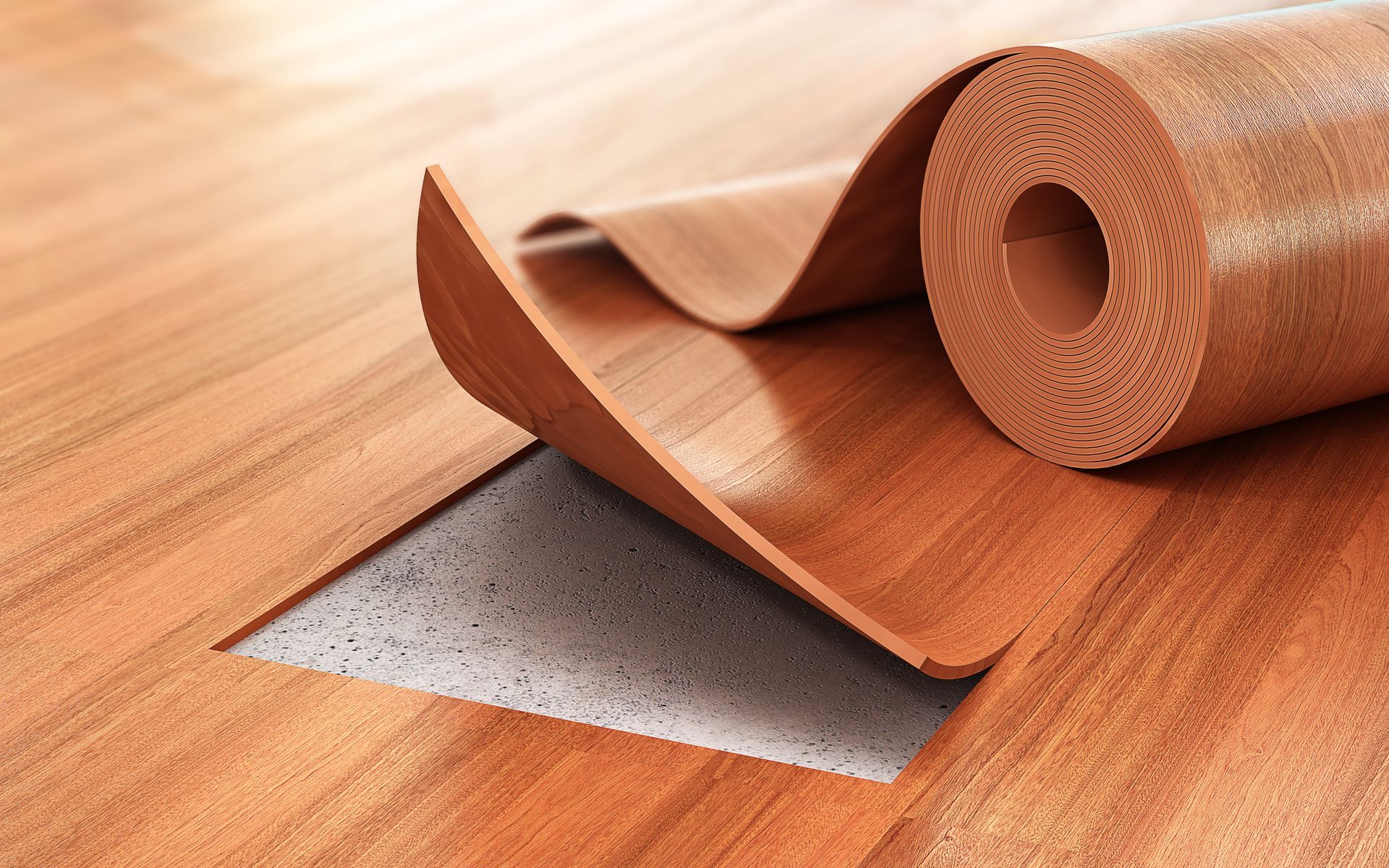 A roll of vinyl flooring is laying on a wooden floor.