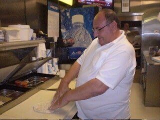 Dine-in — Chef Mixing Flour to Pizza Dough in Pittsburgh & McMurray, PA
