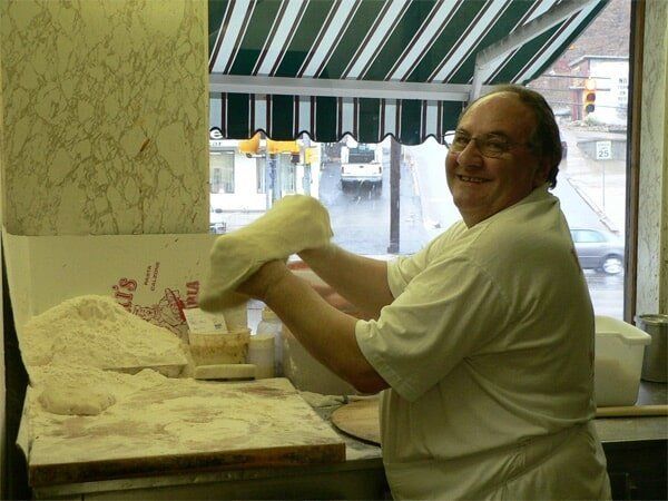 Restaurant — Pizza Maker Smiling in Pittsburgh & McMurray, PA