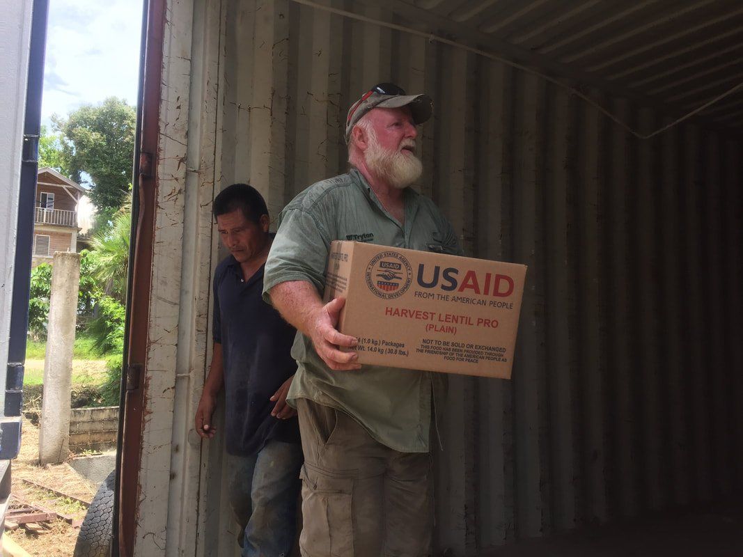 delivering boxes of USAID food to Guatemala
