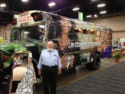Dr. John LaNoue in front of our bus given to WMU