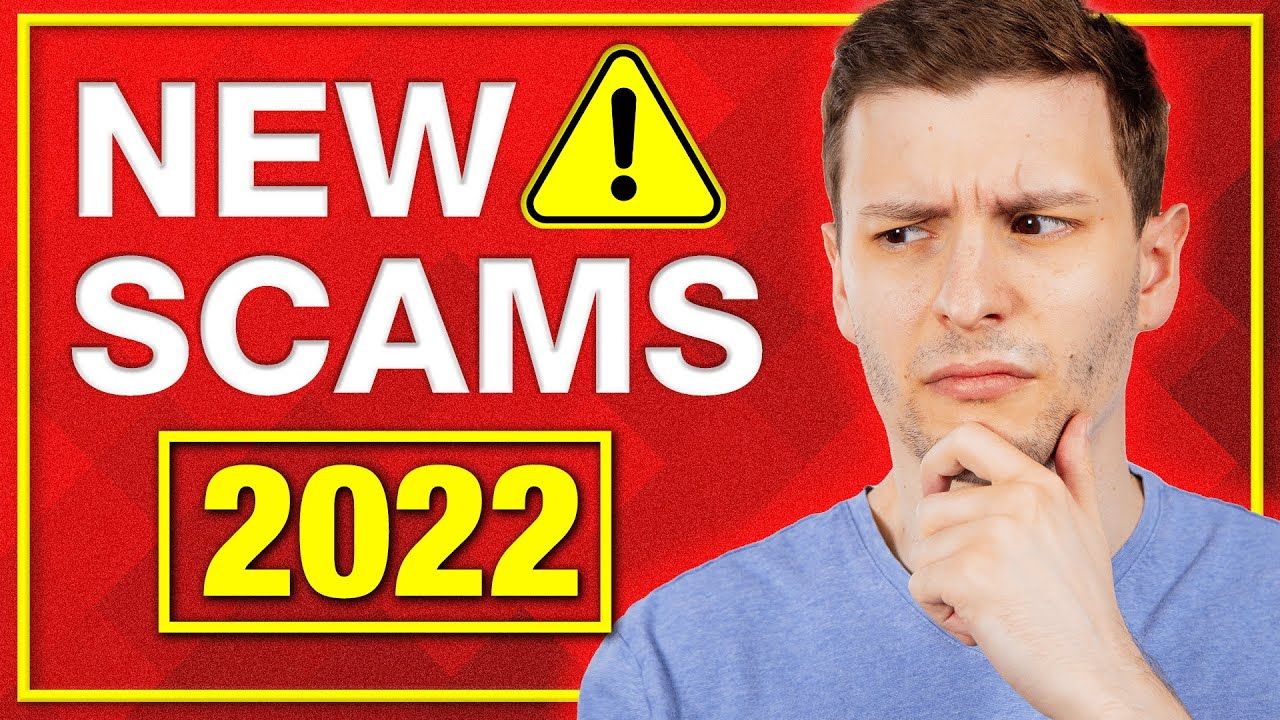 A man is standing in front of a sign that says new scams 2022.