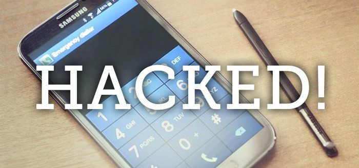 A cell phone with the word hacked on it