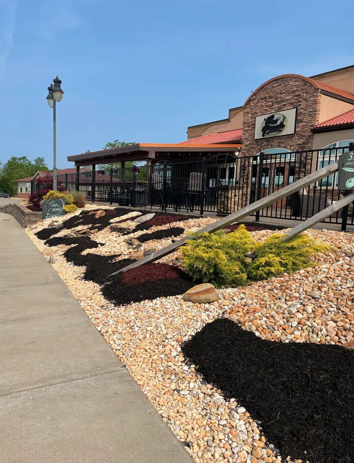 A restaurant with a lot of rocks in front of it