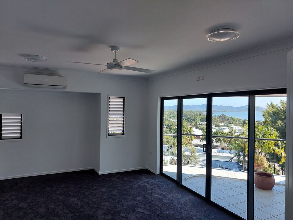 Empty room with lights and smoke detector — Electrician in Mount Louisa QLD