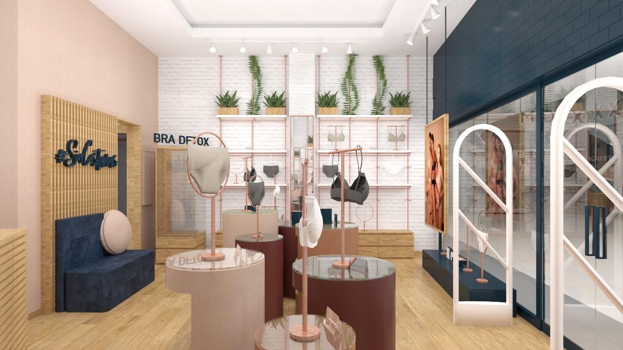 Planificación digital de la impresión de una tienda de ropa con sofá y mesas.