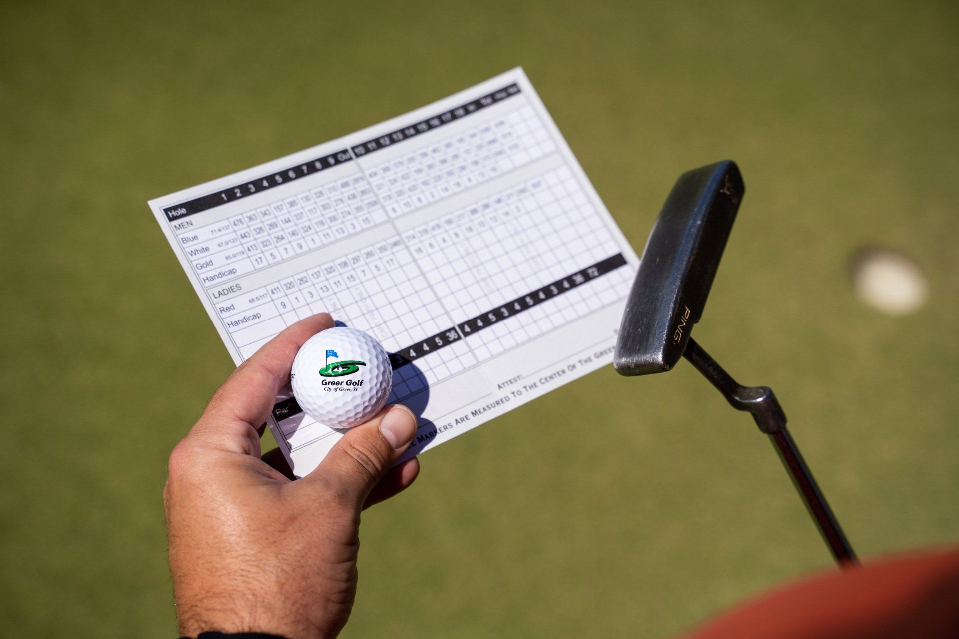 Greer Golf scorecard, ball and putter